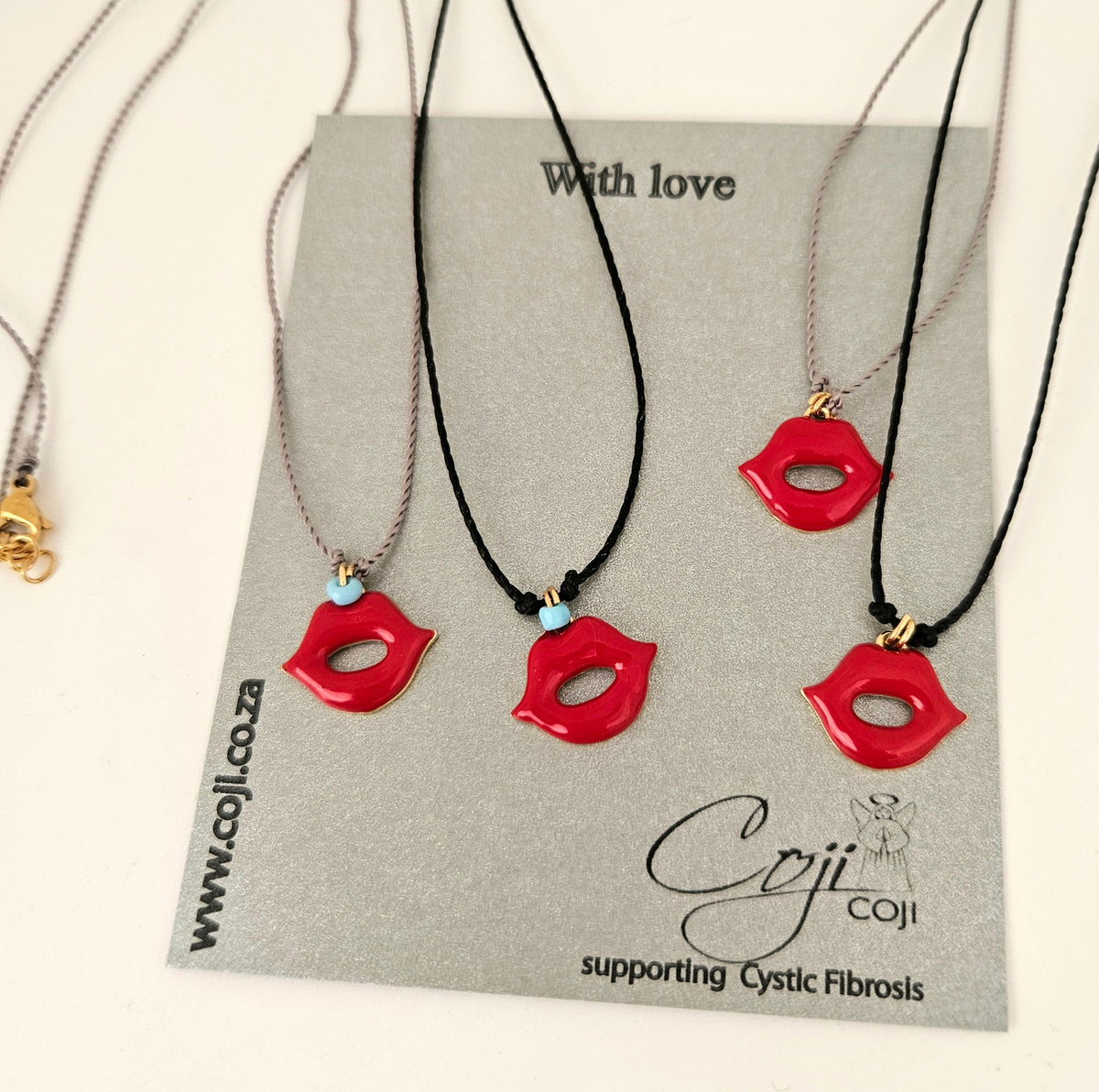 Red lips on silk necklace